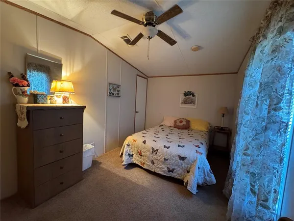 a bathroom with a sink a toilet and shower curtain