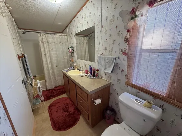 a kitchen with stainless steel appliances a stove a sink dishwasher and cabinets with wooden floor