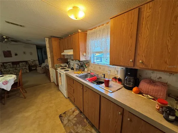 a kitchen with refrigerator and car