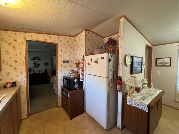 a living room with furniture a rug and a ceiling fan