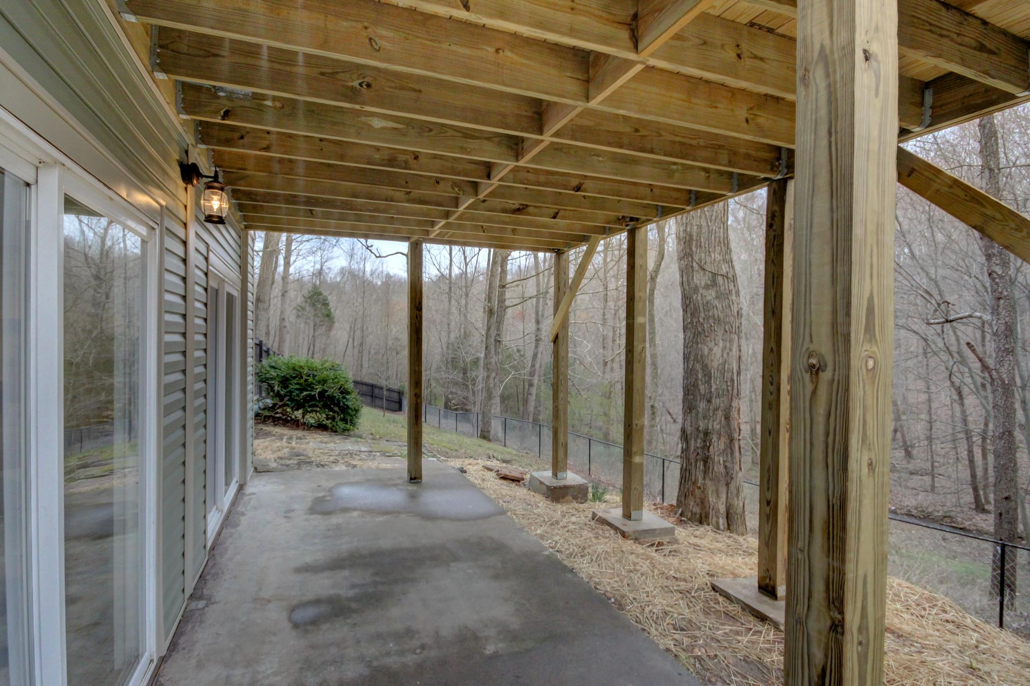 446 Harper Road Clarksville, TN 37043 - Photo 22 of 25 a view of a porch with a table and chairs