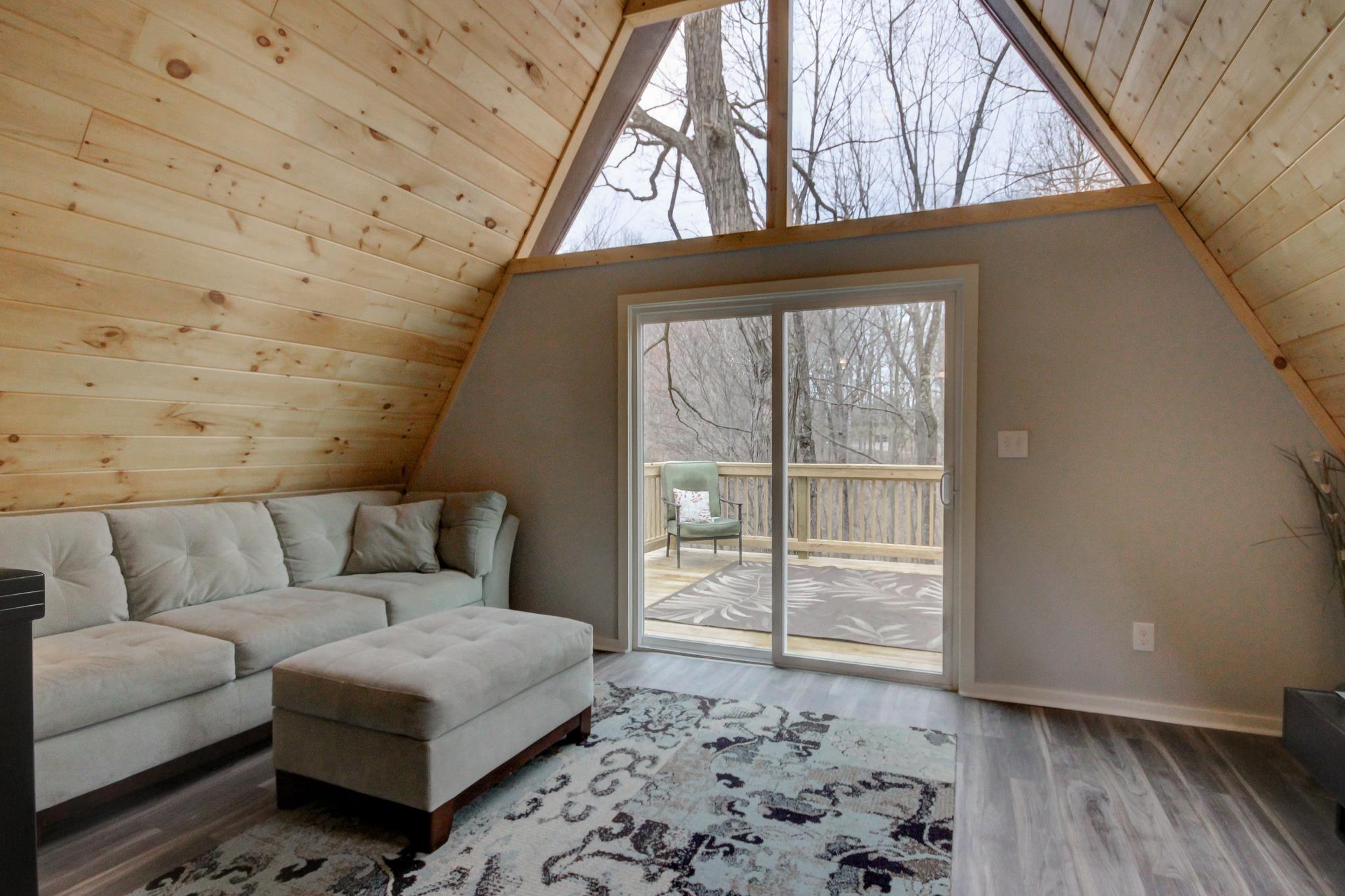 446 Harper Road Clarksville, TN 37043 - Photo 4 of 25 a living room with a couch next to a window