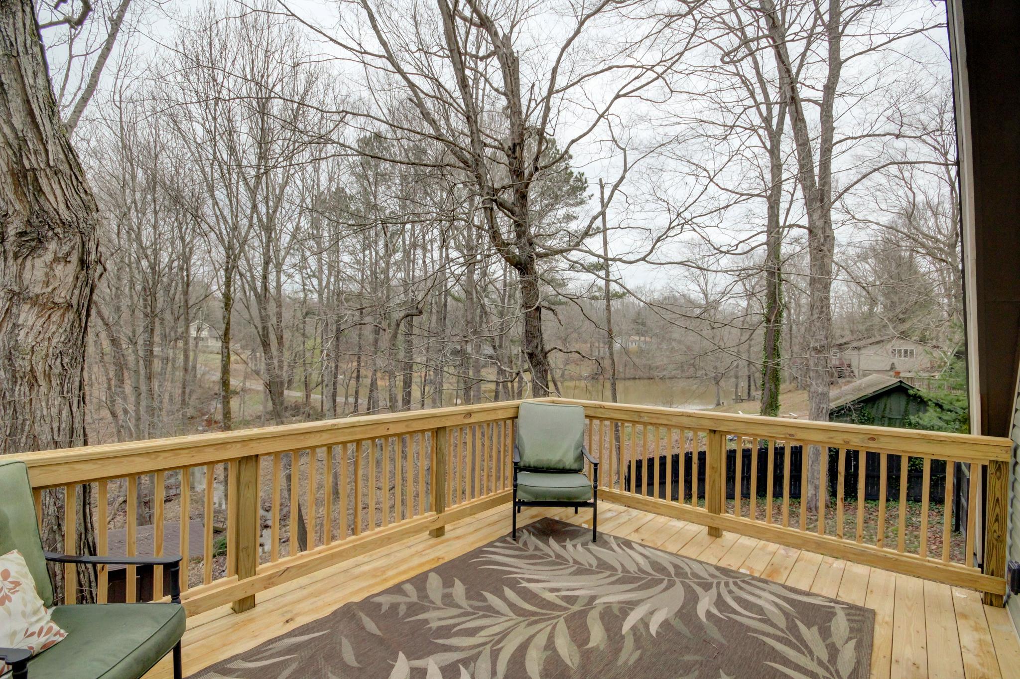446 Harper Road Clarksville, TN 37043 - Photo 8 of 25 a balcony with wooden floor and fence