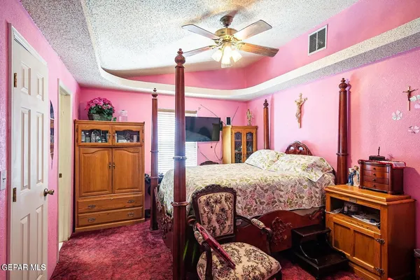 a bed room with a bed next to a window