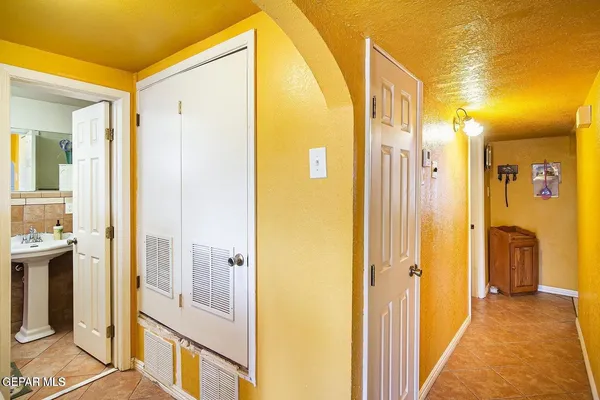 a view of a bathroom with a tub and shower