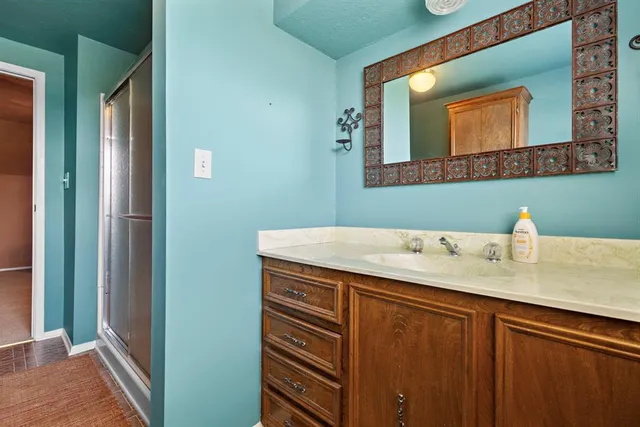 a bathroom with a sink and a mirror