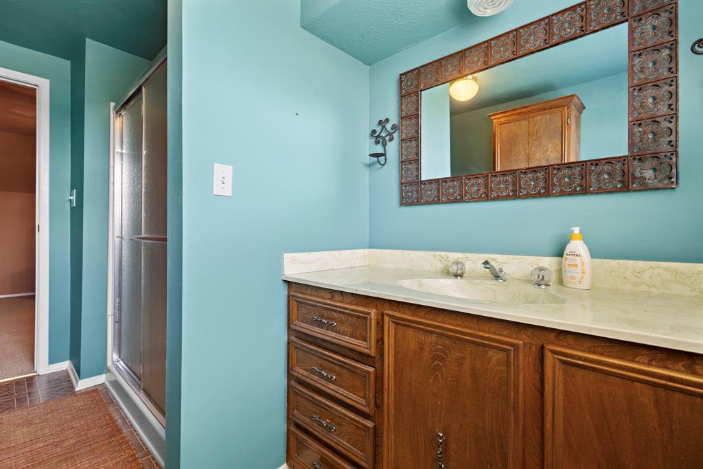 118 Cinch Buckle Ranch Road Trinidad, TX 75163 - Photo 13 of 28 a bathroom with a sink and a mirror