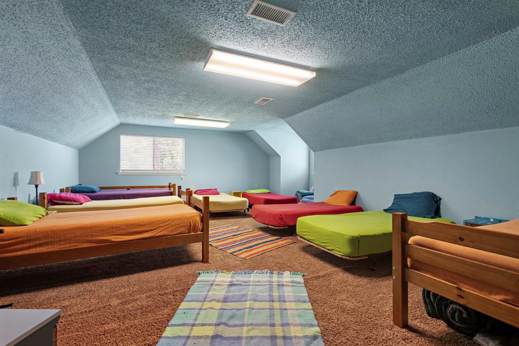 118 Cinch Buckle Ranch Road Trinidad, TX 75163 - Photo 16 of 28 a bedroom with two beds and painted room