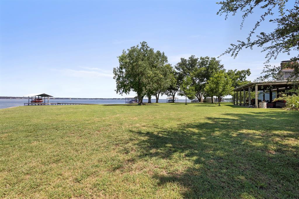 118 Cinch Buckle Ranch Road Trinidad, TX 75163 - Photo 24 of 28 a view of pool and trees in the background