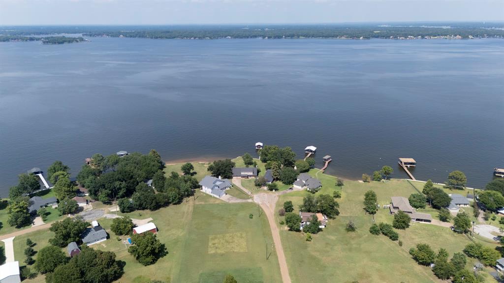 118 Cinch Buckle Ranch Road Trinidad, TX 75163 - Photo 25 of 28 a view of a lake with a yard