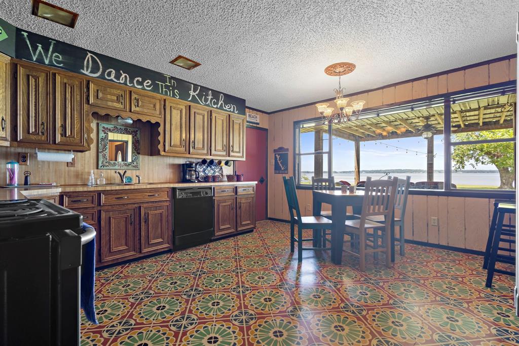 118 Cinch Buckle Ranch Road Trinidad, TX 75163 - Photo 8 of 28 a kitchen with a table chairs sink and cabinets