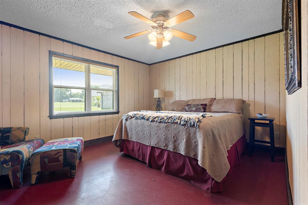 118 Cinch Buckle Ranch Road Trinidad, TX 75163 - Photo 10 of 28 a bed sitting in a bedroom next to a window