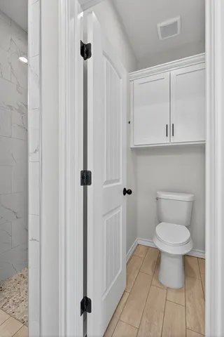 a bathroom with a toilet