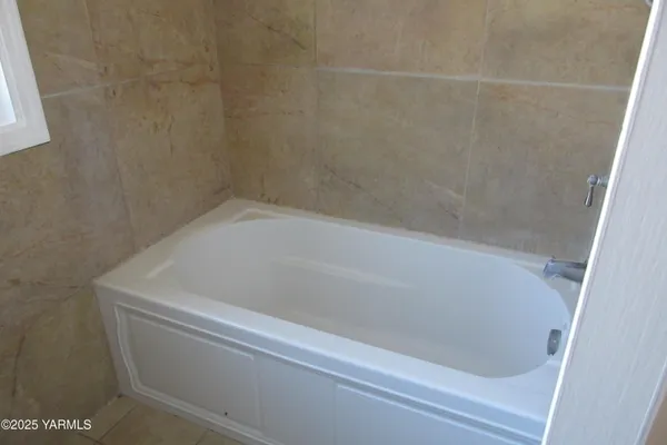 a close up of a bathtub in a bathroom