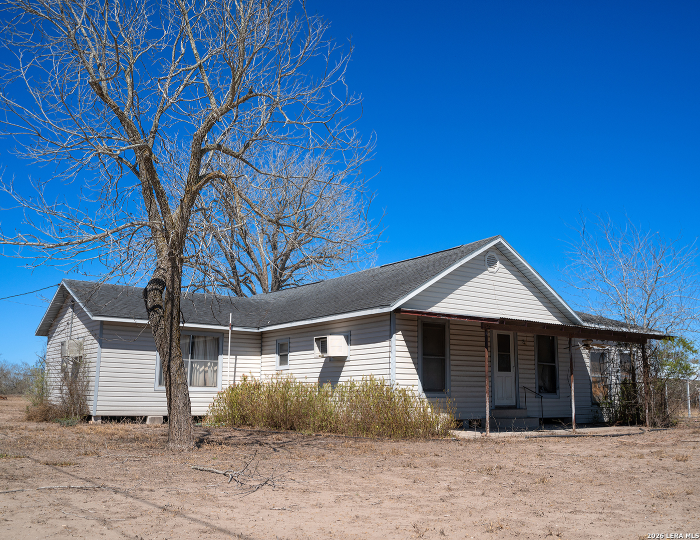 1580 Middle Road George West, TX 78022 - Photo 2 of 15 a front view of a house with a yard