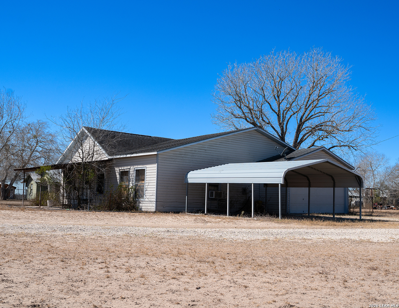 1580 Middle Road George West, TX 78022 - Photo 3 of 15 a front view of a house with a yard and garage