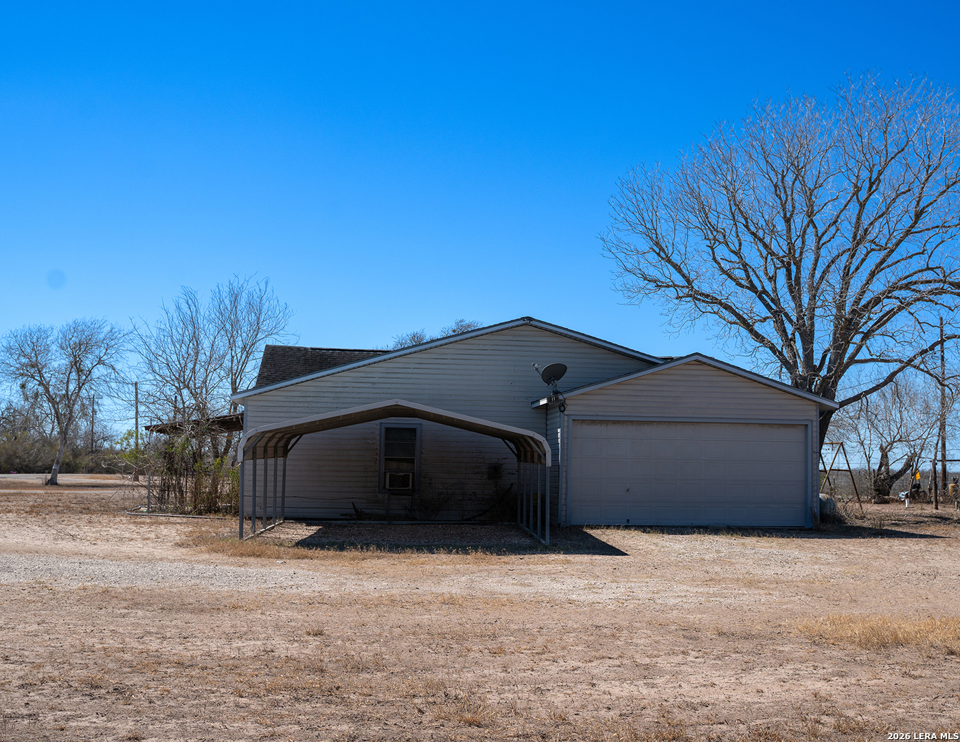 1580 Middle Road George West, TX 78022 - Photo 4 of 15 a house with trees in the background