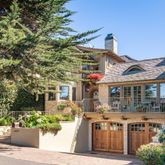 a front view of house with a garden