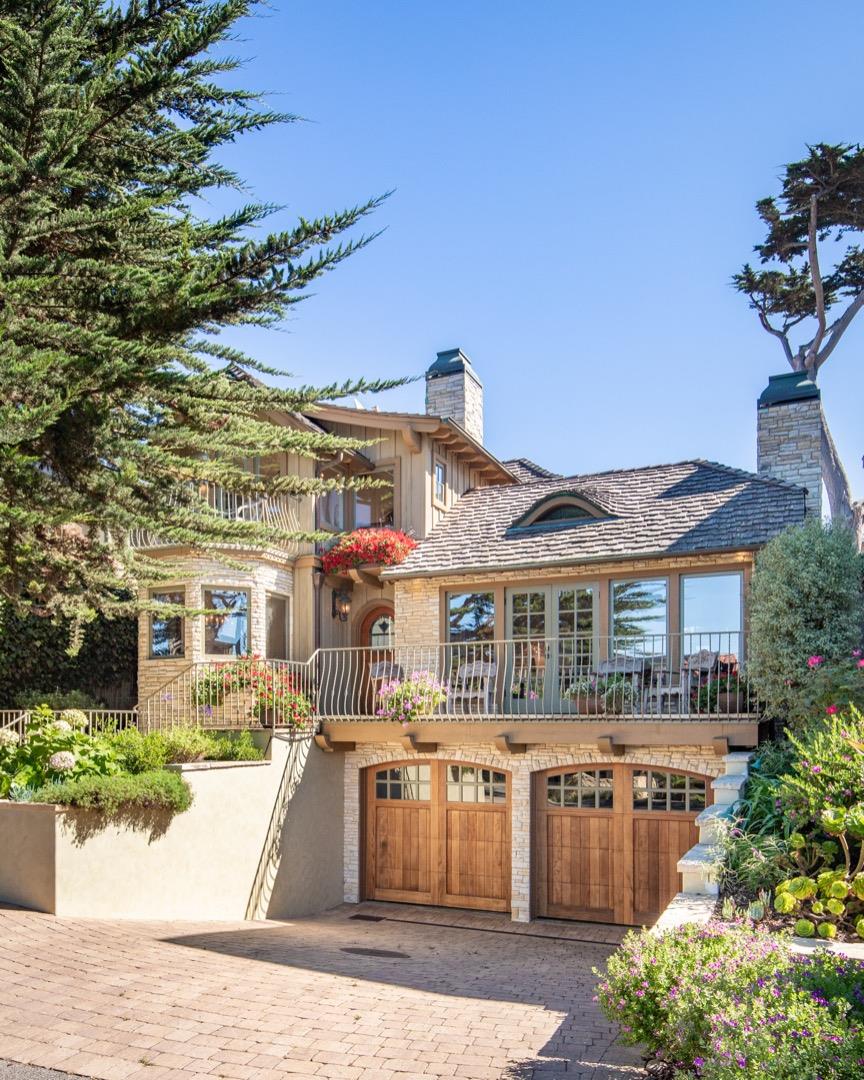 26255 Ocean View Avenue Carmel, CA 93923 - Photo 2 of 20 a front view of a house with a garden