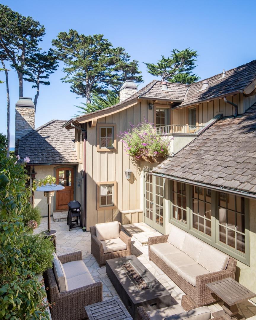 26255 Ocean View Avenue Carmel, CA 93923 - Photo 19 of 20 a view of a house with backyard porch and sitting area