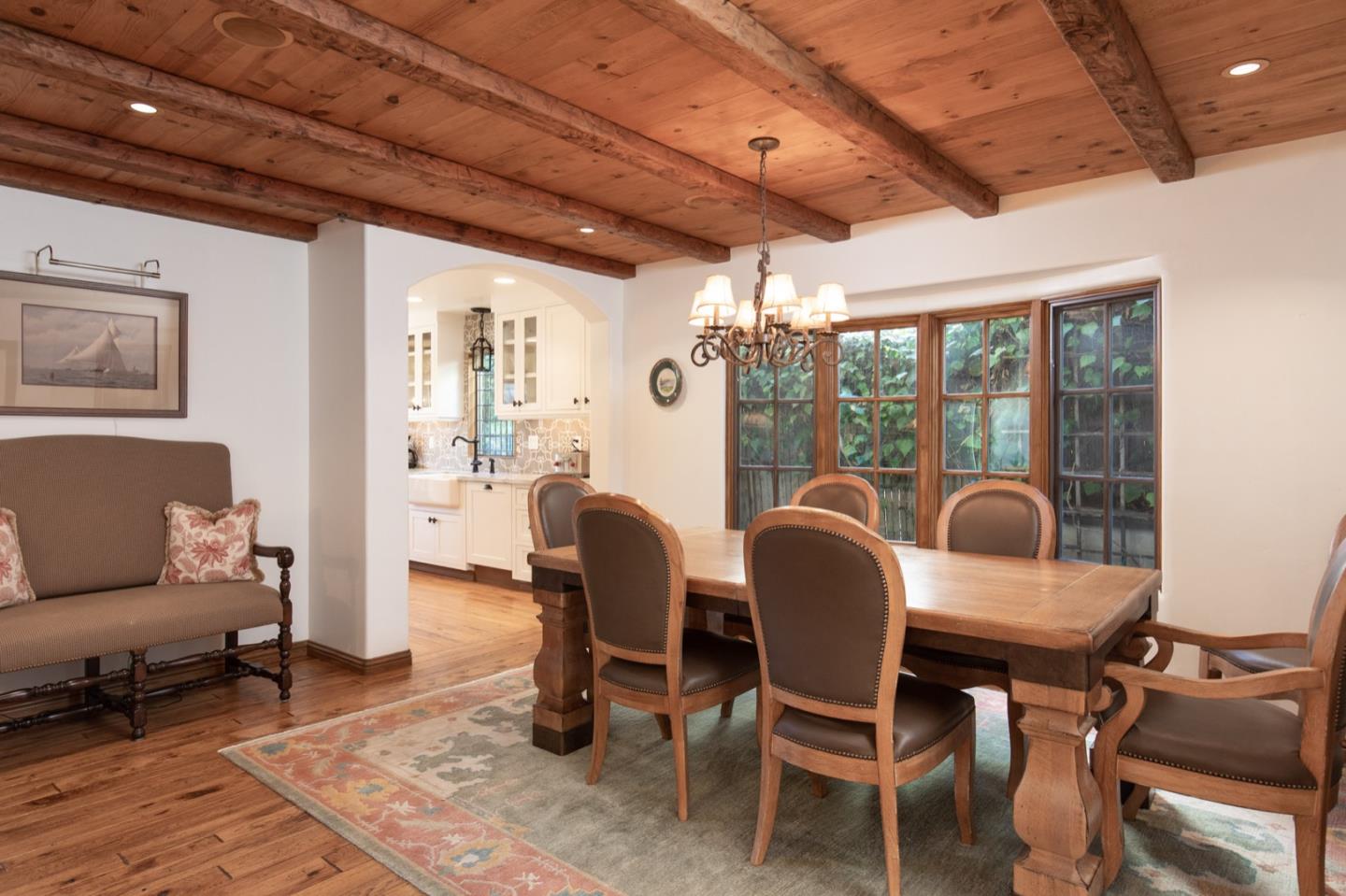 26255 Ocean View Avenue Carmel, CA 93923 - Photo 8 of 20 a dining room with furniture and wooden floor