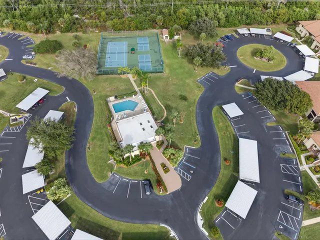 an aerial view of a house with outdoor space