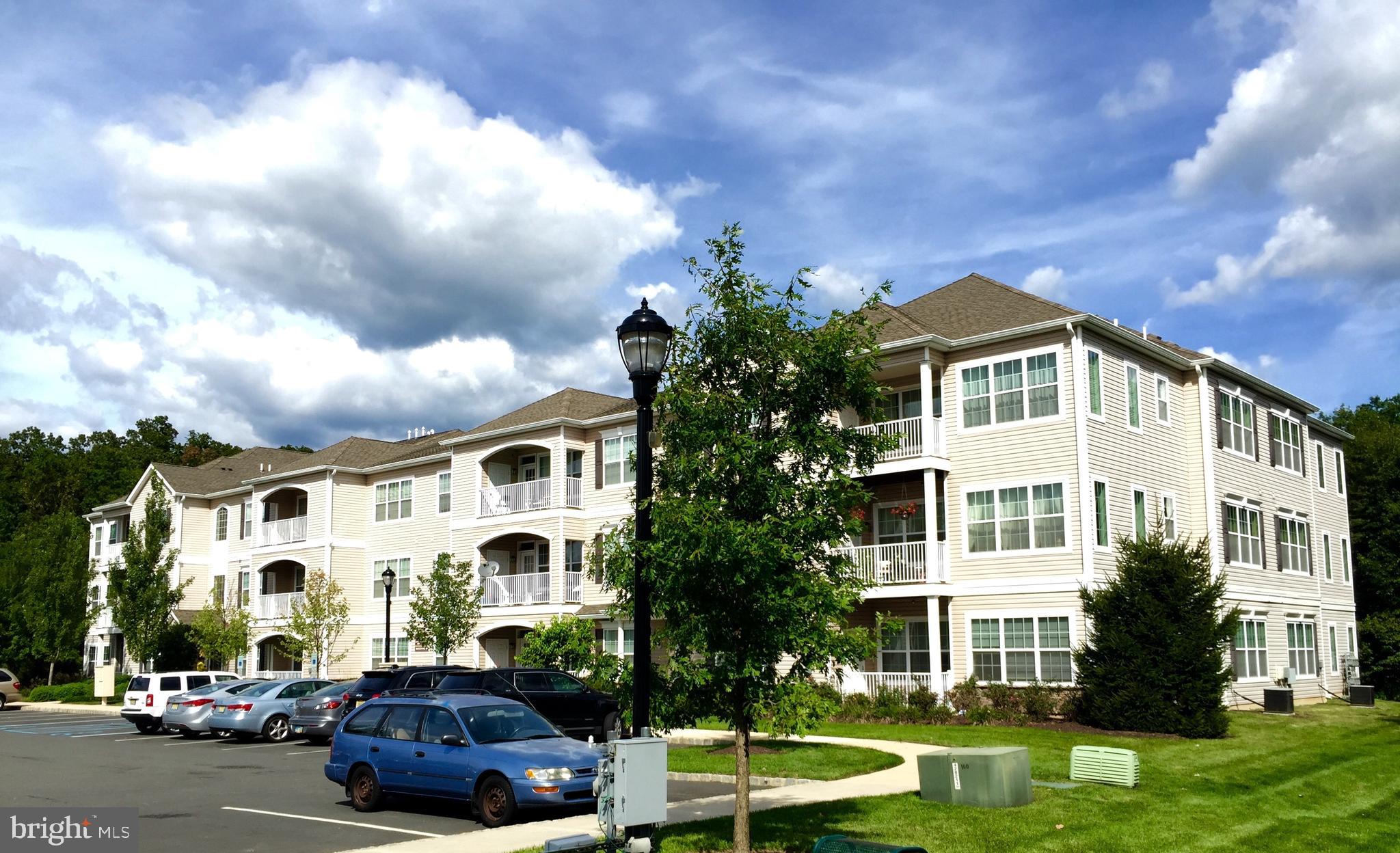 413 Timberlake Drive Ewing, NJ 08618 - Photo 22 of 26 a front view of a house with garden