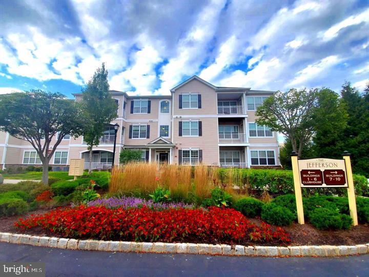 413 Timberlake Drive Ewing, NJ 08618 - Photo 24 of 26 a front view of a house with garden and street