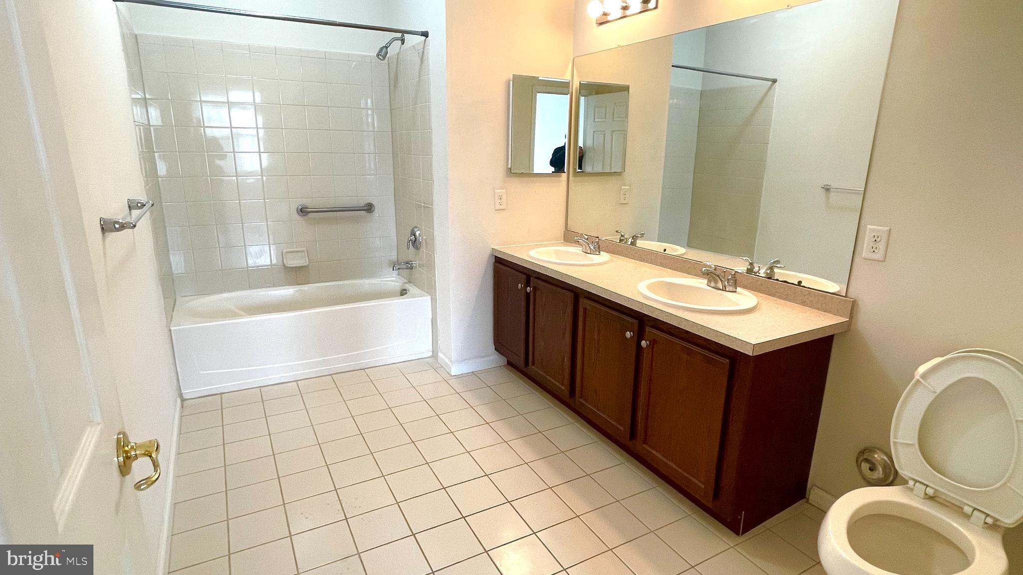 413 Timberlake Drive Ewing, NJ 08618 - Photo 7 of 26 a bathroom with a sink a toilet and shower