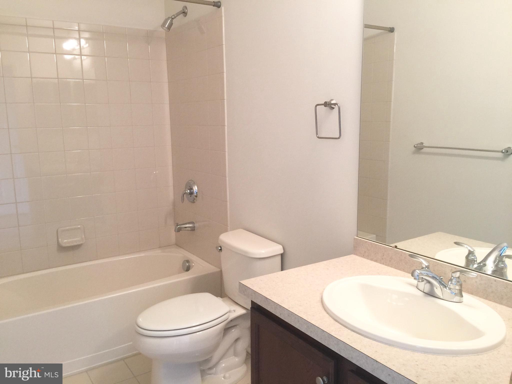 413 Timberlake Drive Ewing, NJ 08618 - Photo 8 of 26 a bathroom with a sink a toilet and shower