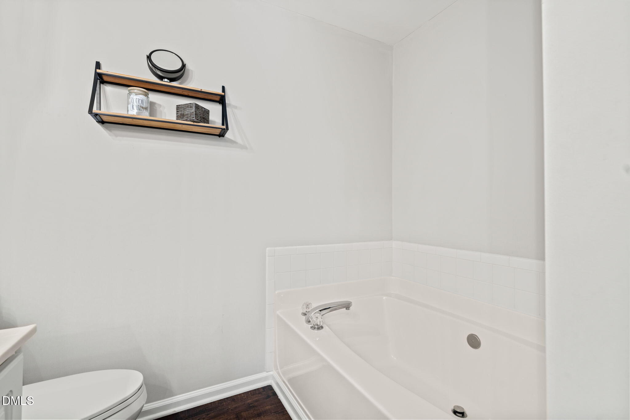 4323 Pine Springs Court Raleigh, NC 27613 - Photo 30 of 38 a bathroom with a bath tub and a toilet