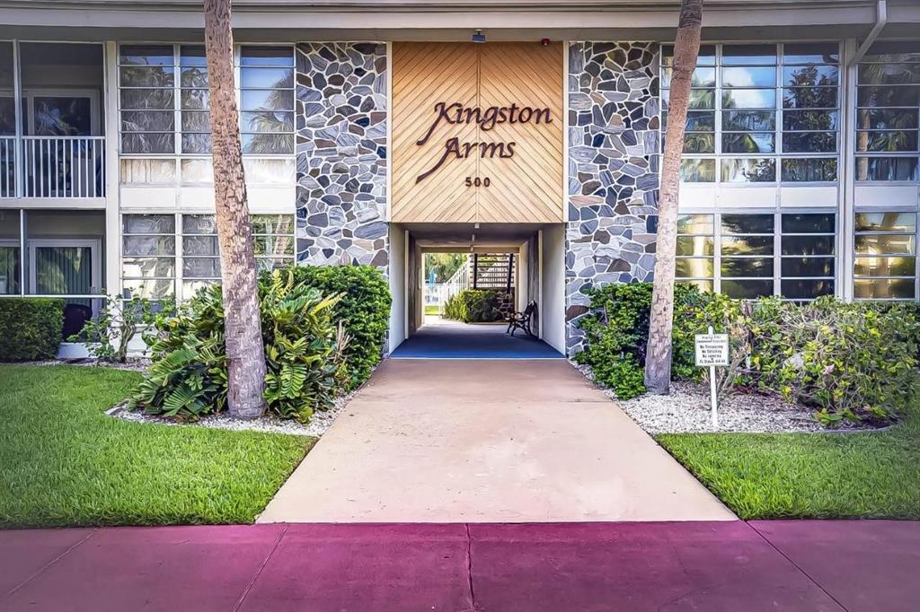 500 South Washington Drive, Unit 24B Sarasota, FL 34236 - Photo 1 of 25 a front view of a house with a yard and garage