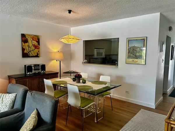 a view of a livingroom with furniture and a flat screen tv