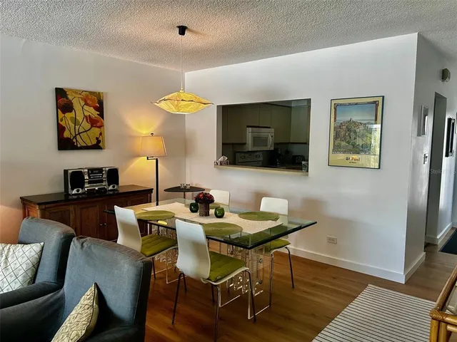 a view of a livingroom with furniture and a flat screen tv
