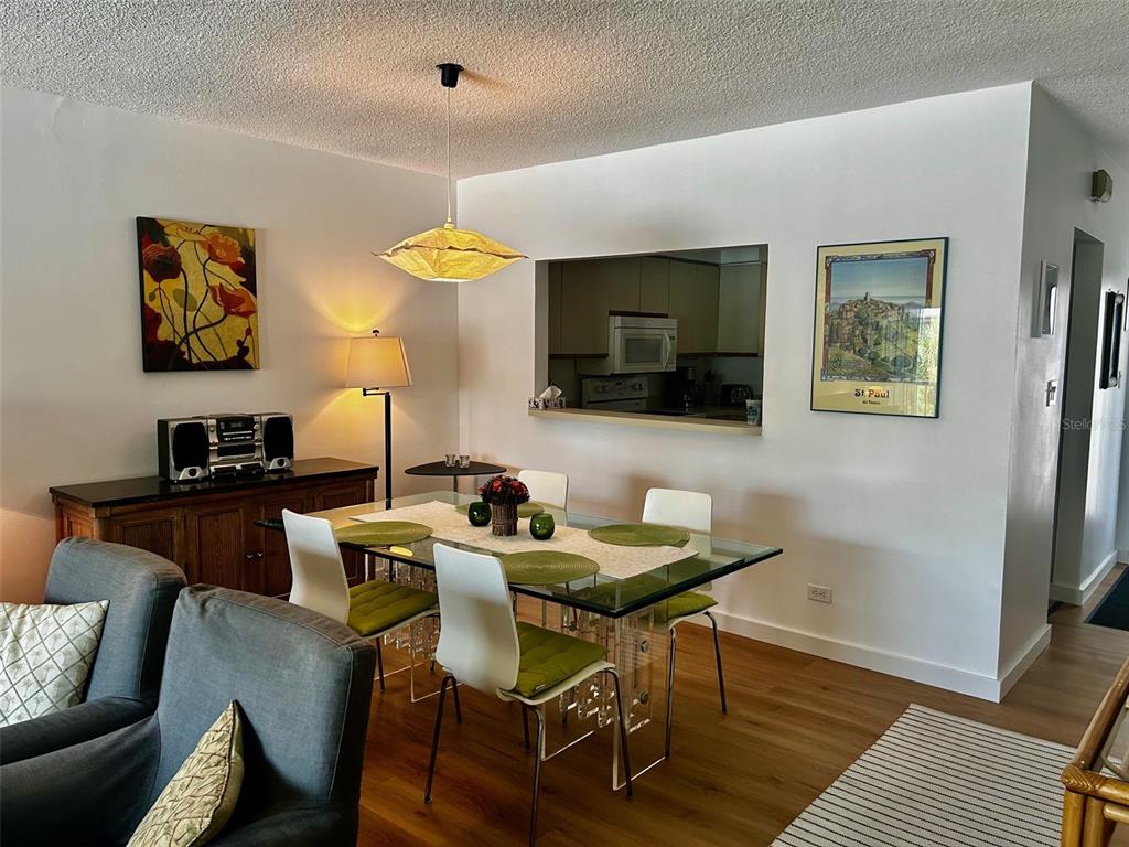500 South Washington Drive, Unit 24B Sarasota, FL 34236 - Photo 13 of 25 a view of a livingroom with furniture and a flat screen tv