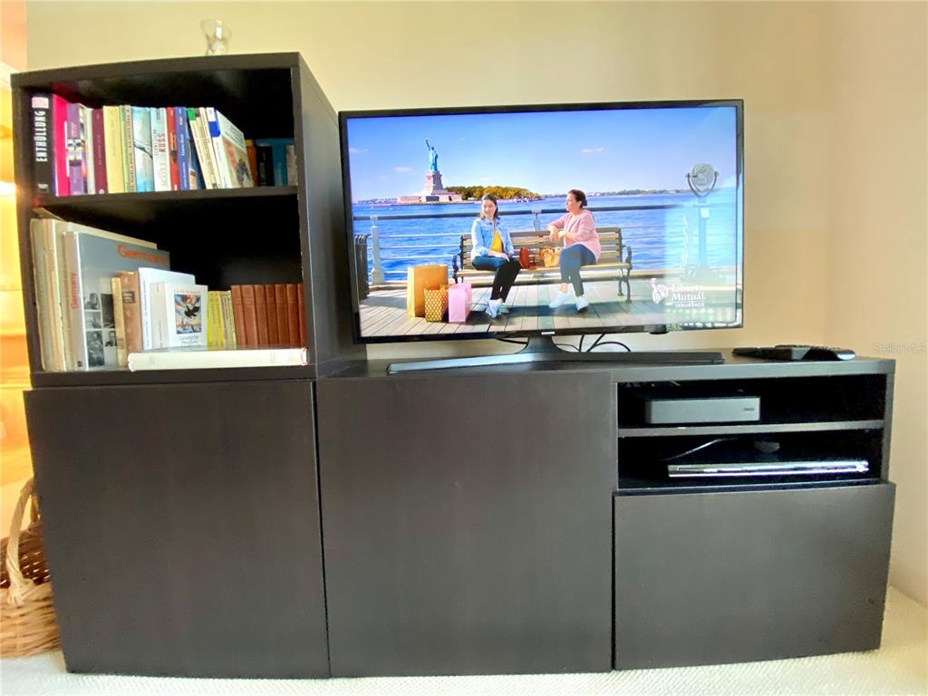500 South Washington Drive, Unit 24B Sarasota, FL 34236 - Photo 15 of 25 a kitchen with stainless steel appliances granite countertop a stove and a microwave