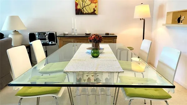 a view of a dining room with furniture and a wooden floor