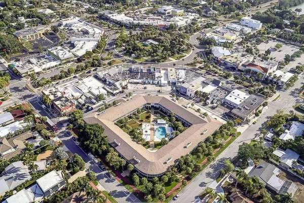 an aerial view of residential houses with outdoor space
