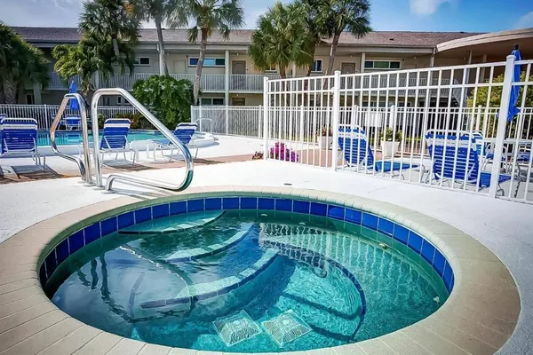 a view of a swimming pools under an umbrella