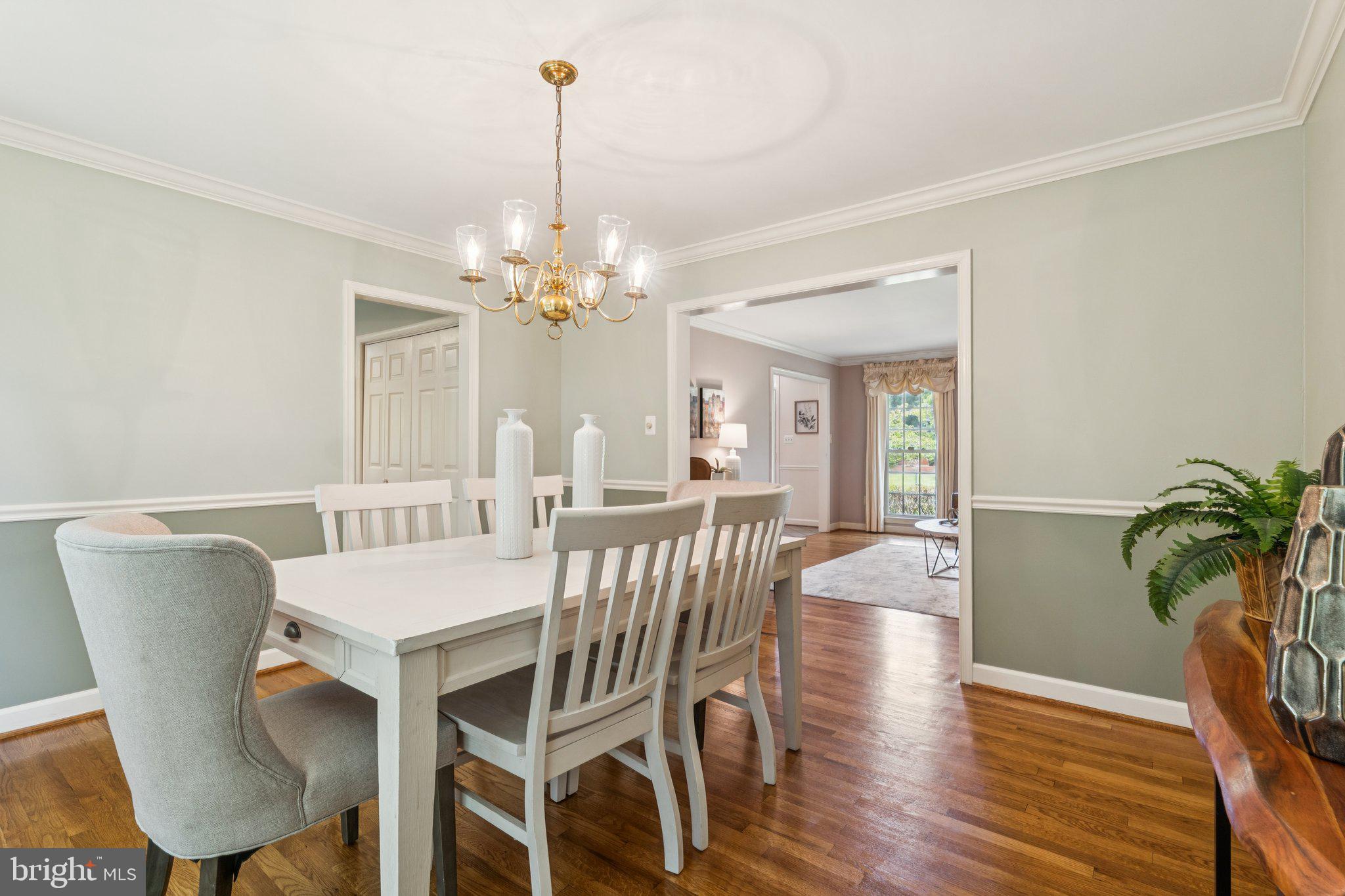 15313 Watergate Road Silver Spring, MD 20905 - Photo 13 of 53 a view of a dining room with furniture window and wooden floor