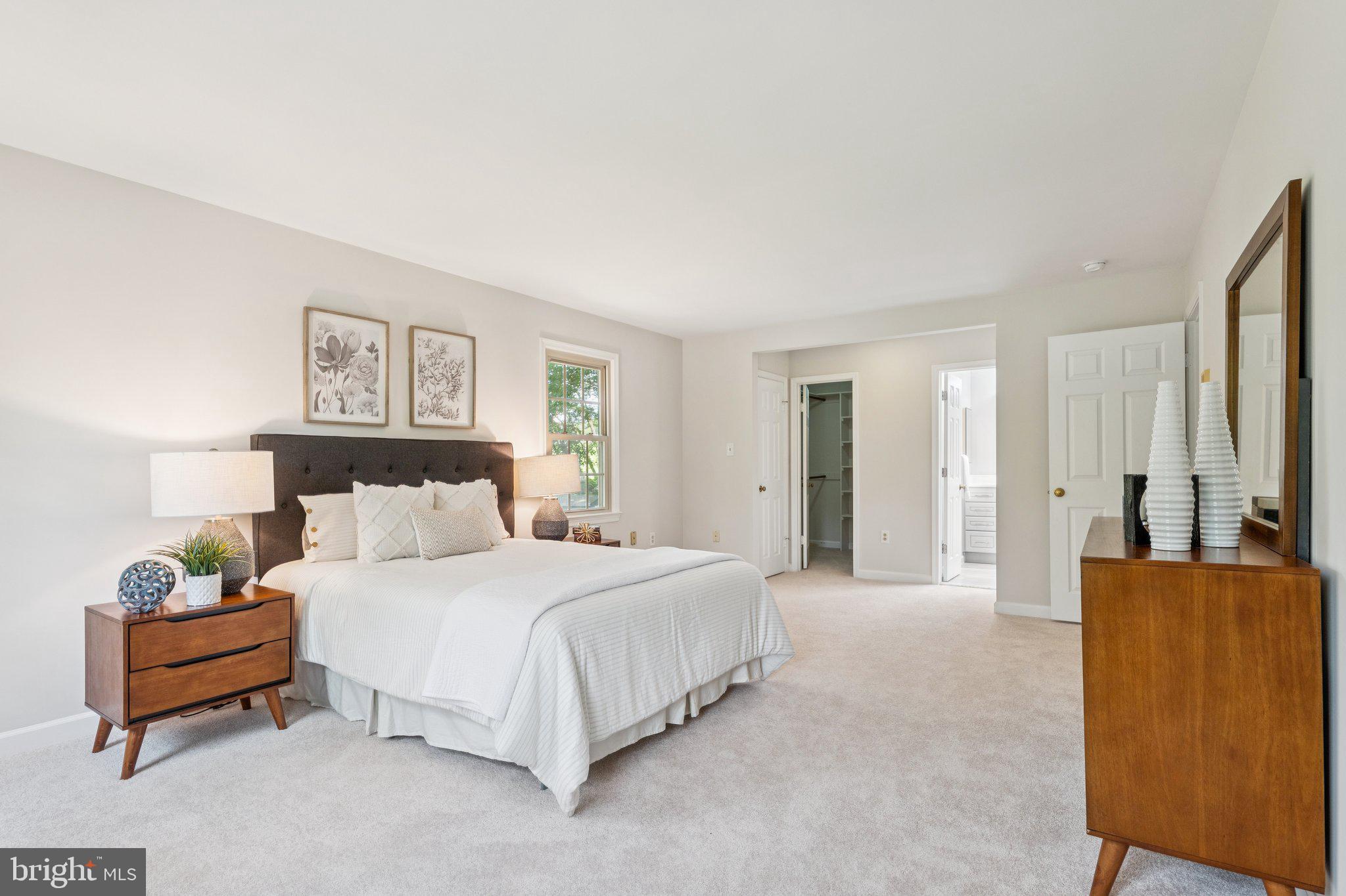 15313 Watergate Road Silver Spring, MD 20905 - Photo 19 of 53 a spacious bedroom with a bed and a couch