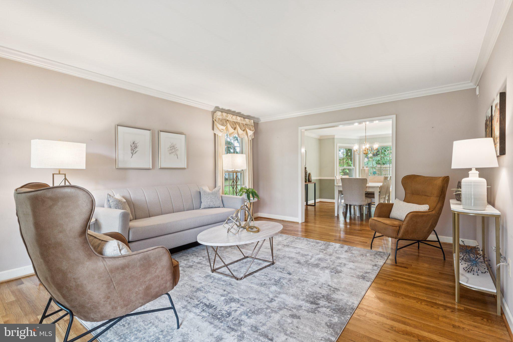 15313 Watergate Road Silver Spring, MD 20905 - Photo 2 of 53 a living room with furniture and a table