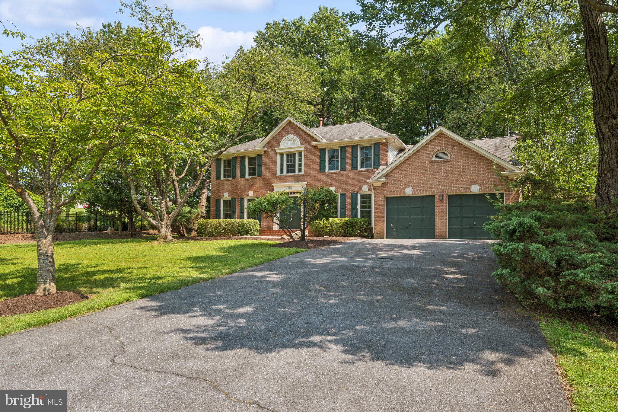 15313 Watergate Road Silver Spring, MD 20905 - Photo 40 of 53 a front view of a house with a yard and garage