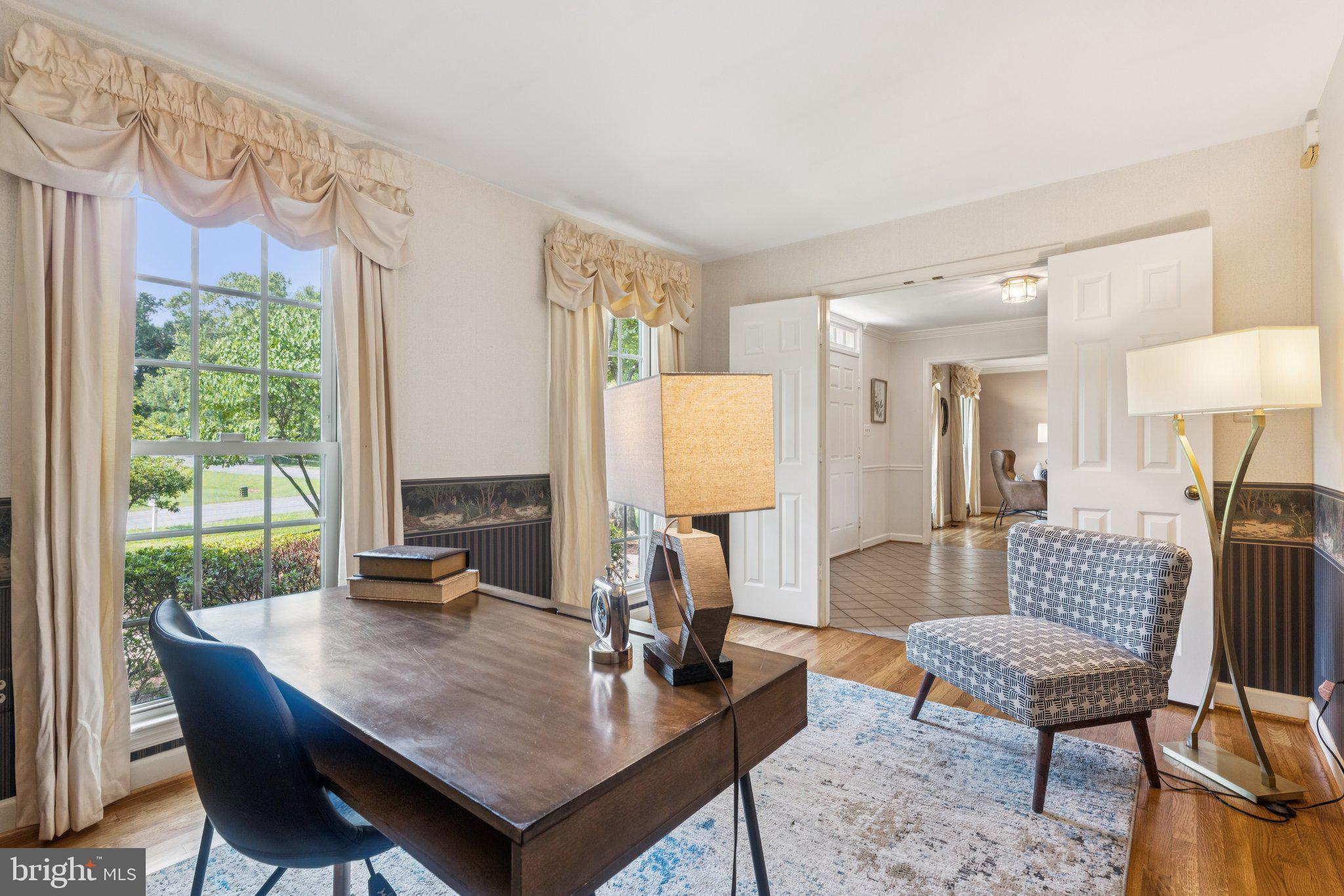 15313 Watergate Road Silver Spring, MD 20905 - Photo 6 of 53 a living room with furniture a table and a large window