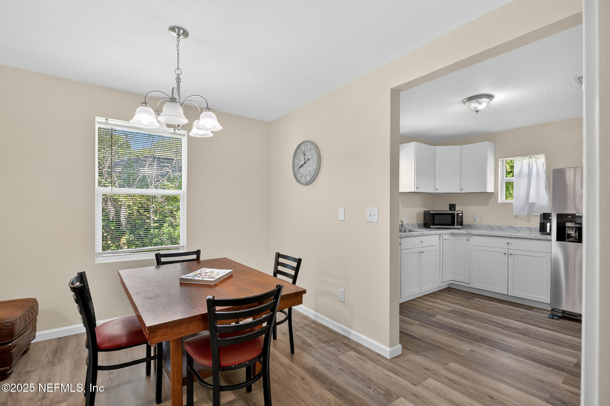 631 Moore Street Baldwin, FL 32234 - Photo 17 of 36 a kitchen with a table and chairs in it