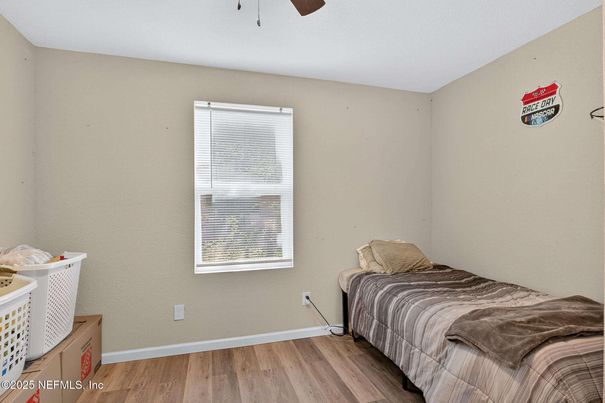 631 Moore Street Baldwin, FL 32234 - Photo 24 of 36 a bedroom with a bed and a window