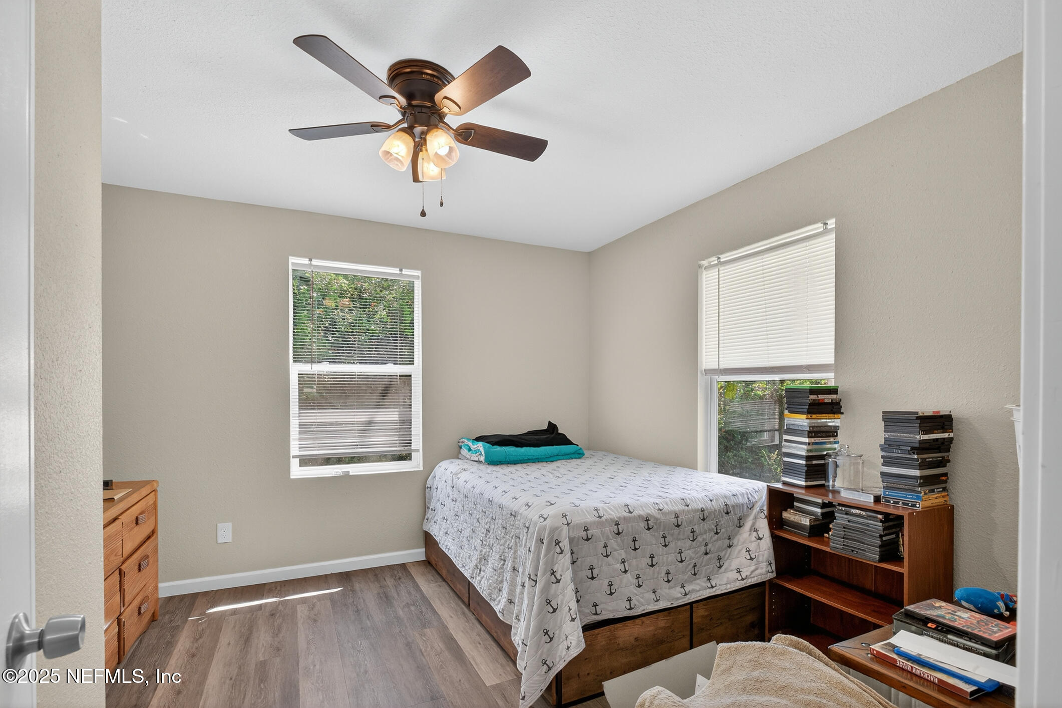 631 Moore Street Baldwin, FL 32234 - Photo 26 of 36 a bedroom with a bed and a window