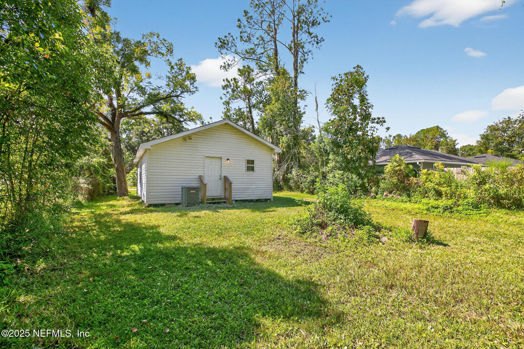 631 Moore Street Baldwin, FL 32234 - Photo 33 of 36 a house view with a garden space