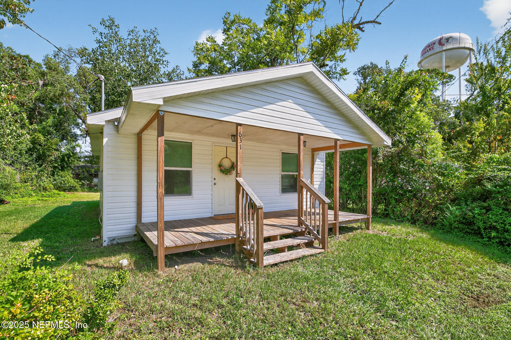 631 Moore Street Baldwin, FL 32234 - Photo 34 of 36 a view of backyard with a barn and large trees