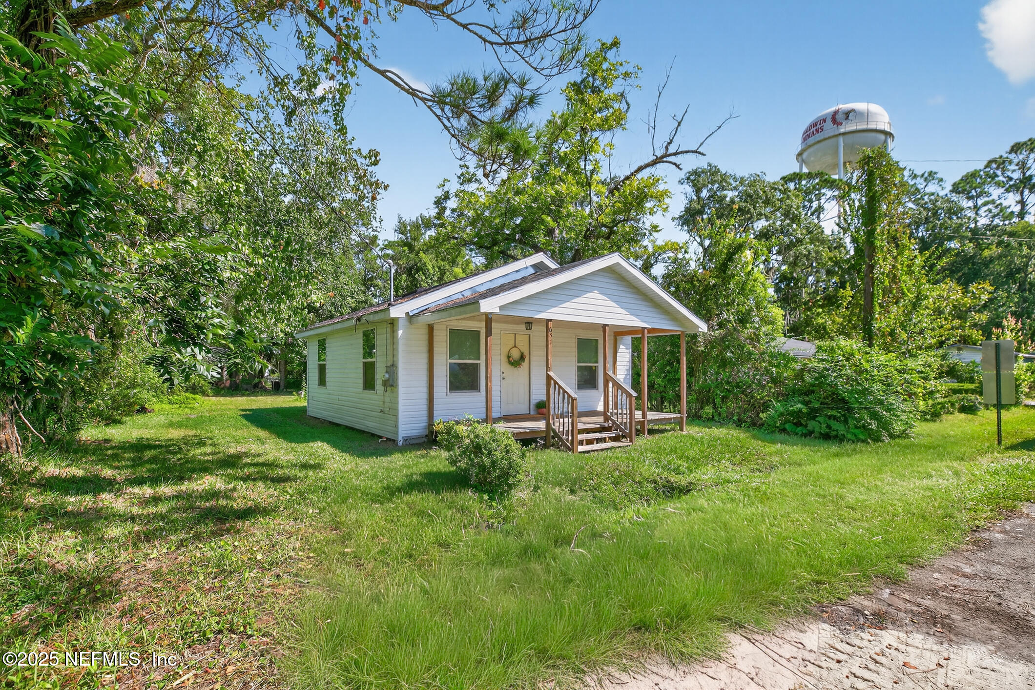 631 Moore Street Baldwin, FL 32234 - Photo 35 of 36 a front view of a house with garden